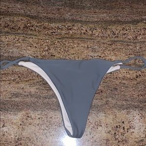 Reversible grey to white thong bikini